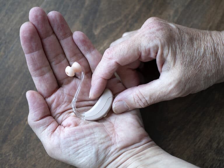 Senior home care can help aging seniors adjust to using a hearing aid.